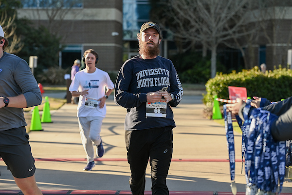 Swoop the Loop participant crossing the finish line