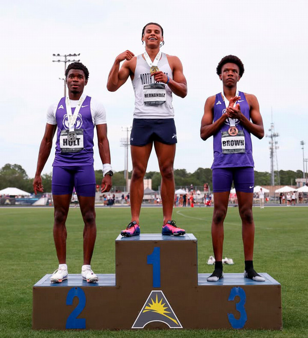 UNF track and field athlete Rey Hernandez at the winner podium