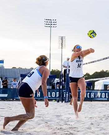 UNF volleyball player getting ready to hit the ball