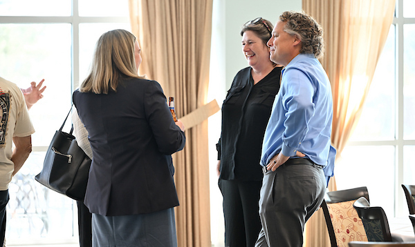 UNF faculty members socializing at an event