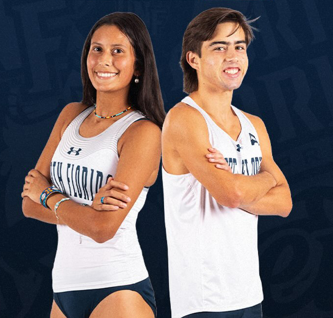 Two UNF cross country student-athletes standing back to back