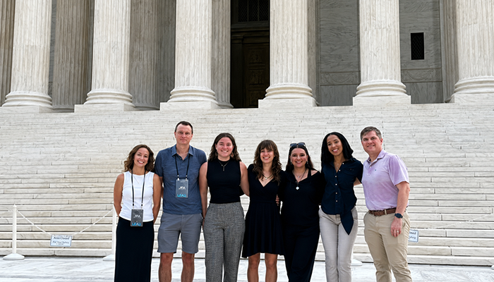 Seven UNF faculty and students in front of Washington, D.C. monument