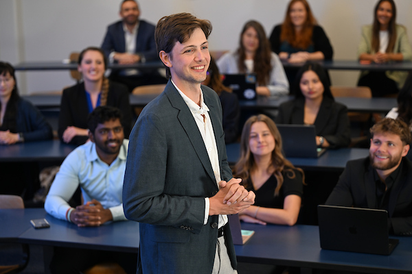 UNF Coggin graduate student presenting in front of his classmates