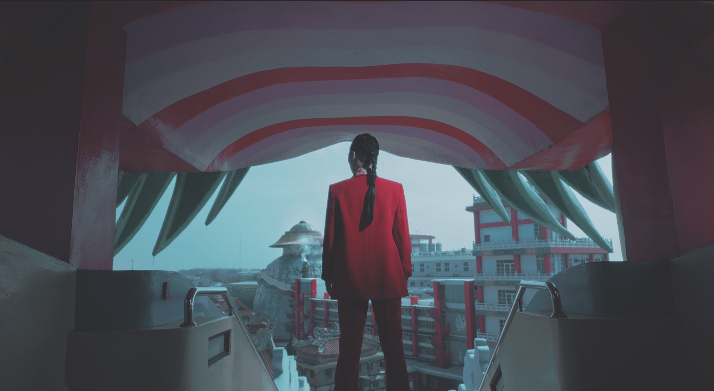 Promotion image for Future Shock showing a figure standing in front of a city.
