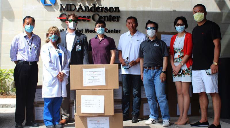 Volunteers outside medical center with donated supplies
