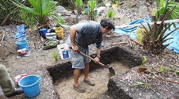 Archaeology student digging ground on ancient Indigenous site