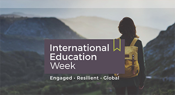 shot of a woman looking over a mountain range - International Education Week: Engaged, Resilient, Global