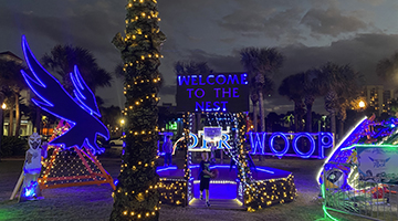 UNFs display at Deck the Chairs featuring a large Osprey and the word - swoop - lit up in Christmas lights