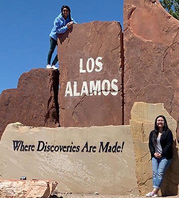 Two students standing outside the Los Alamos National Laboratory during a trip to Los Alamos, New Mexico. 