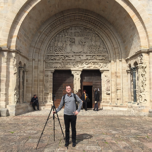 Dr. Scott Brown standing in front of a cathedral 