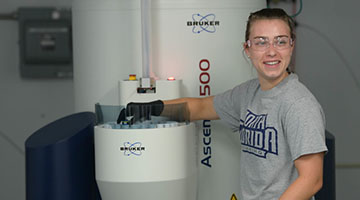 Elise Ballash conducting research in a lab setting