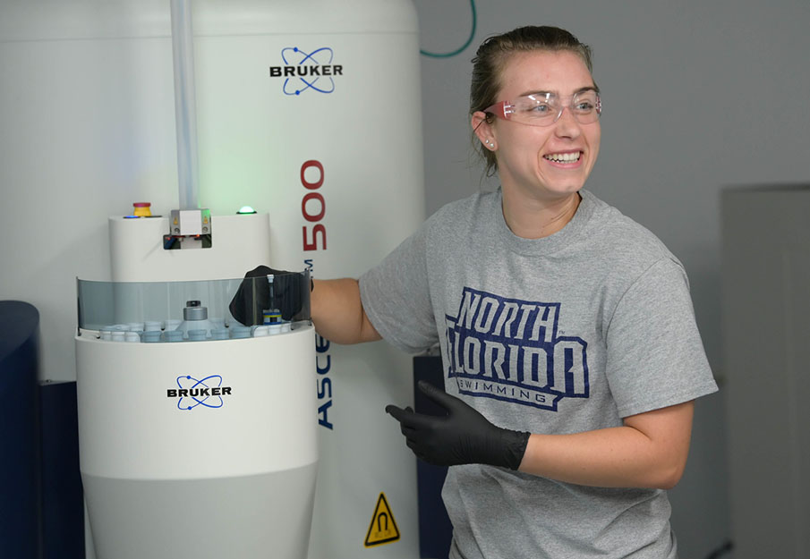 Elise Ballash conducting research in a lab