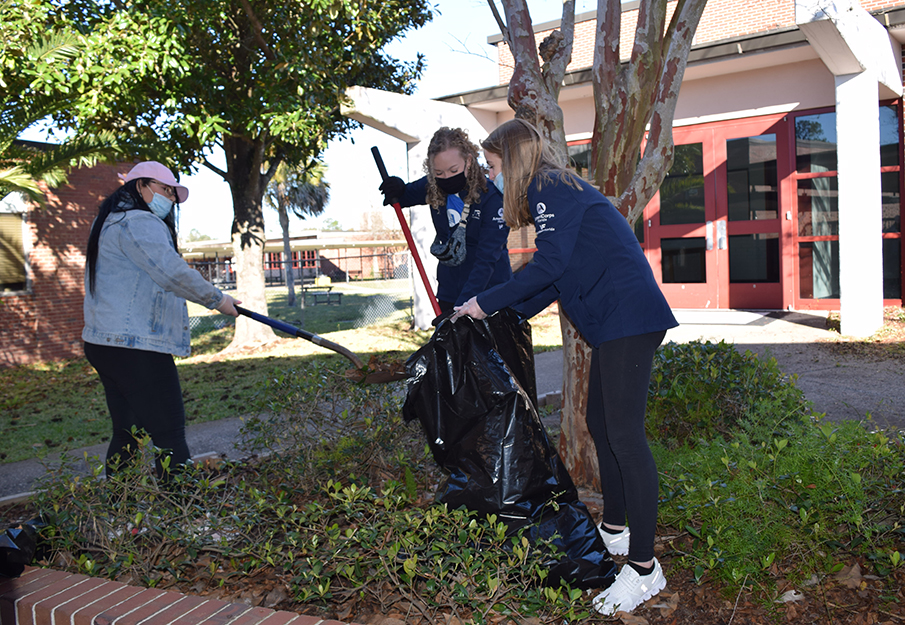 Students taking part in a beautification project at a local public school