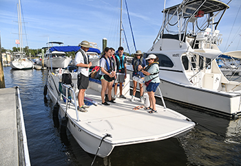 Marine biology students getting ready for an excursion on the UNF research boat