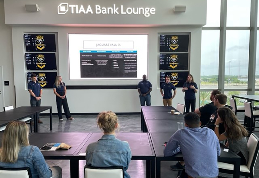 Taylor Leadership Institute students facilitating a leadership training session for members of the Jacksonville Jaguars staff.