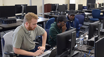 One of the student teams working on their project for the AI for Good Hackathon