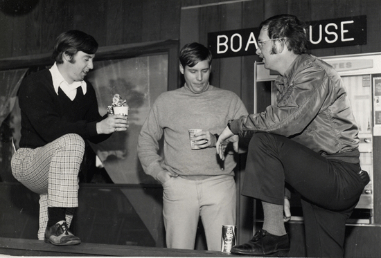 Three men chatting in the original UNF Boathouse restaurant