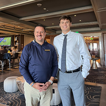 Brady Okla posing with his Executive Leadership Mentor in the Ritz Leadership program Gary Virden