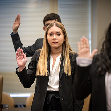 Cassie Muse being sworn in with other interns - photo credit to FBI Jacksonville