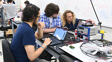 The UNF engineering students working on a project for Innovation Day