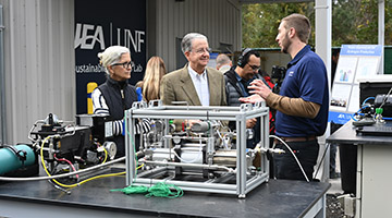 A UNF-JEA employee showing off machinery at the new Sustainable Solutions Lab