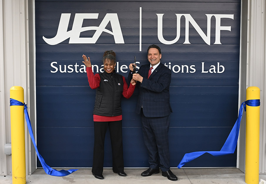 UNF President Moez Limayem and JEA Chief Operating Officer Raynetta Curry Marshall cutting ribbon at new Sustainable Solutions Lab
