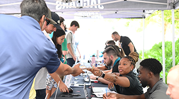 Students getting season tickets for the Jacksonville Jaguars game