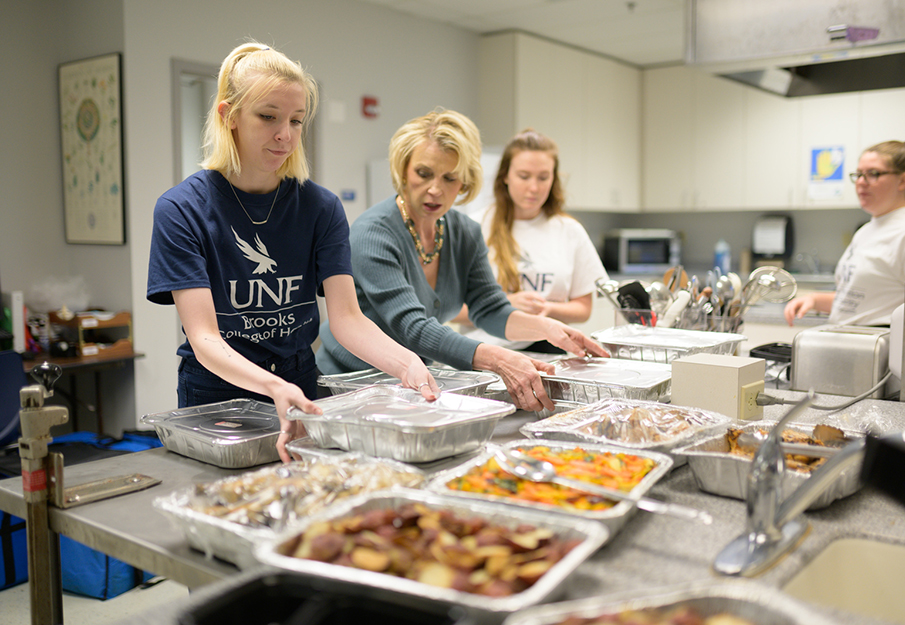 Meals on Wings volunteers preparing food for delivery