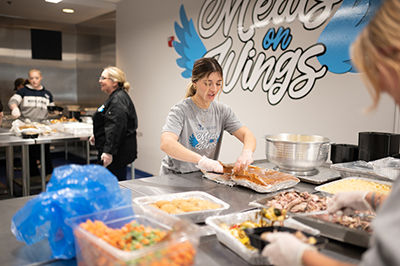 Meals on Wings student volunteers preparing food