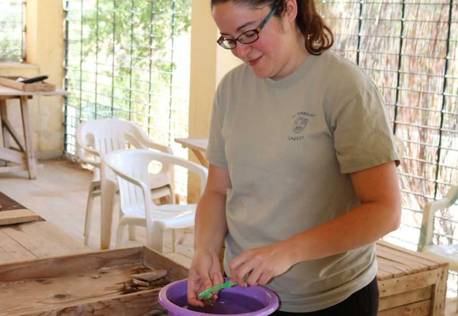Jacqueline Meier cleaning archaeological remains from Greece
