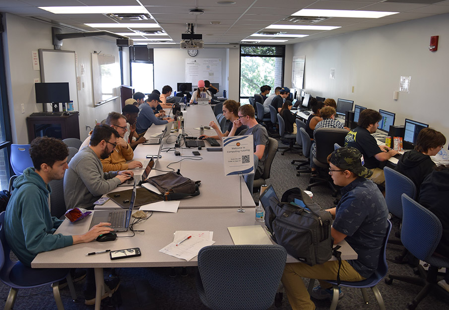 UNF students sitting at their computers creating programs