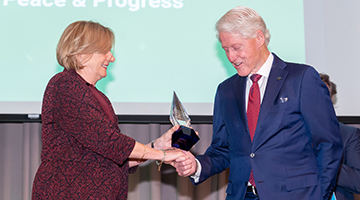 Dr. Soderberg handing President Clinton an award