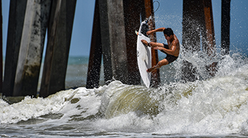 One of the UNF surfers on the water