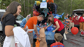 Trunk and Treat kids getting treats from a sea theme trunk