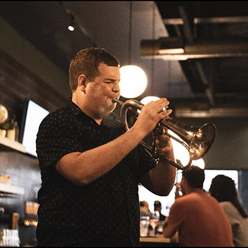 Tyler Heintzen playing a trumpet