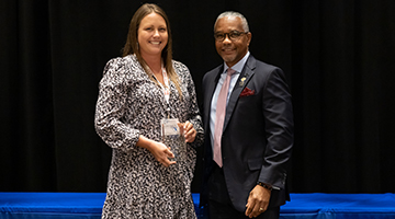 Young Engineer of the Year Award winner, Corey Chascin, holding her award