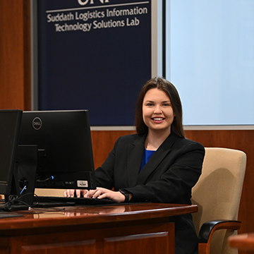 Alexanderia Crotts sitting at a laptop in the Suddath Logistics Information Technology Solutions Lab