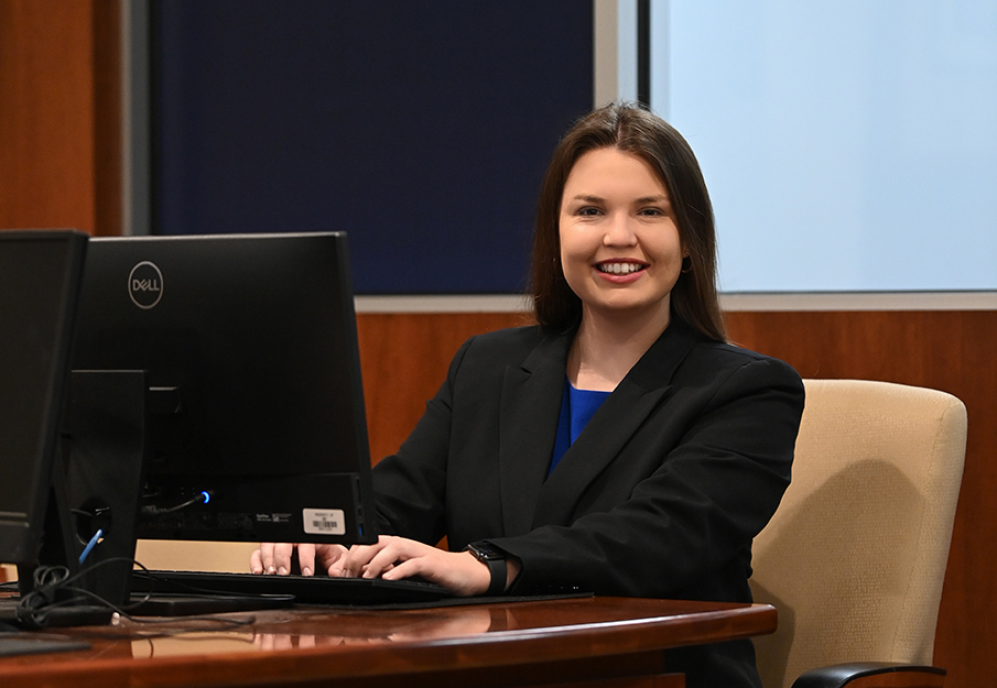 Alexandria Crotts sitting at a computer