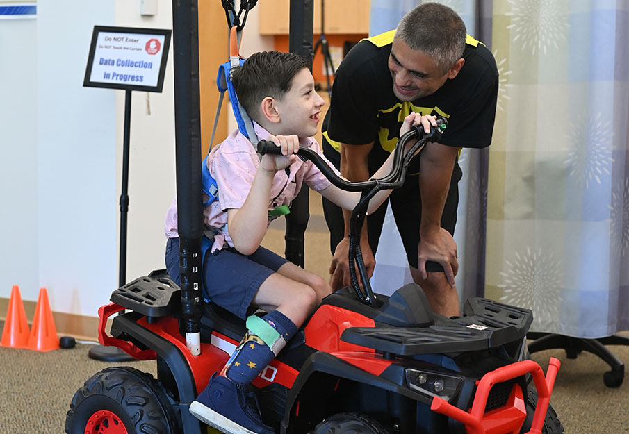Finn Valentin participating in a power mobility clinical trial