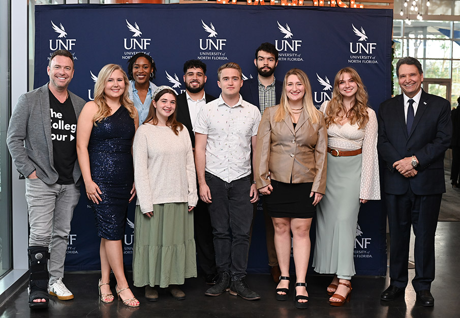 UNF President Moez Limayem, College Tour host Alex Boylan and eight of the ten students featured in the UNF College Tour Episode