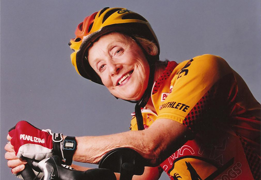 Dorothy "Dottie" Dorion posing on a bike in biking gear