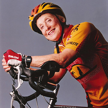 Dorothy "Dottie" Dorion posing on a bike in biking gear