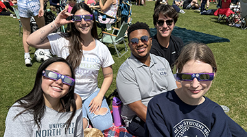 Friends watching the eclipse at UNF