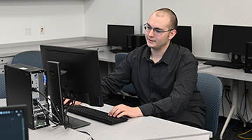 Furio Gerwitz working on a computer