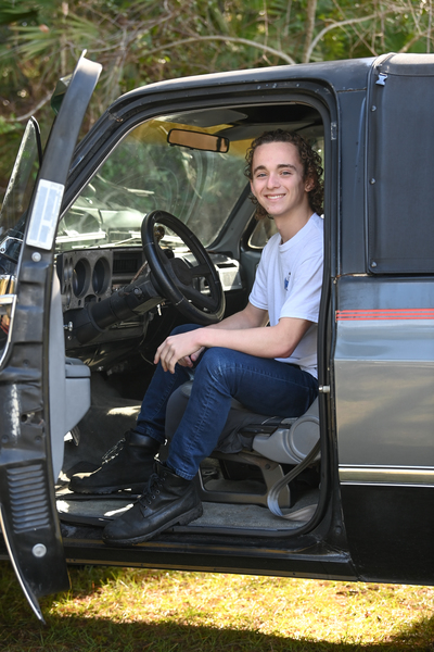 UNF student Hunter Ford sitting in a truck