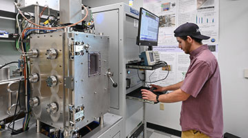 Hudson Horne working on a machine
