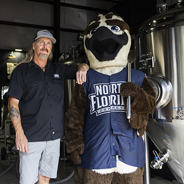 Aaron Meisenheimer and Ozzie in the brewery