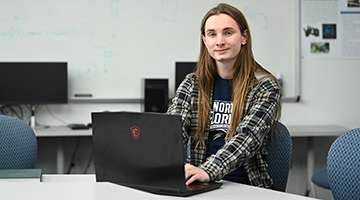 Troy Kidd working on a laptops