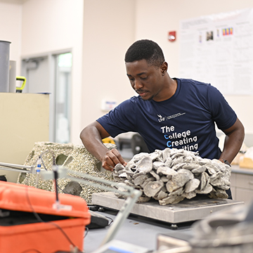 Makaya Malila in a lab working on POSH