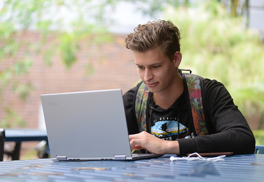 Student using a laptop for an online class